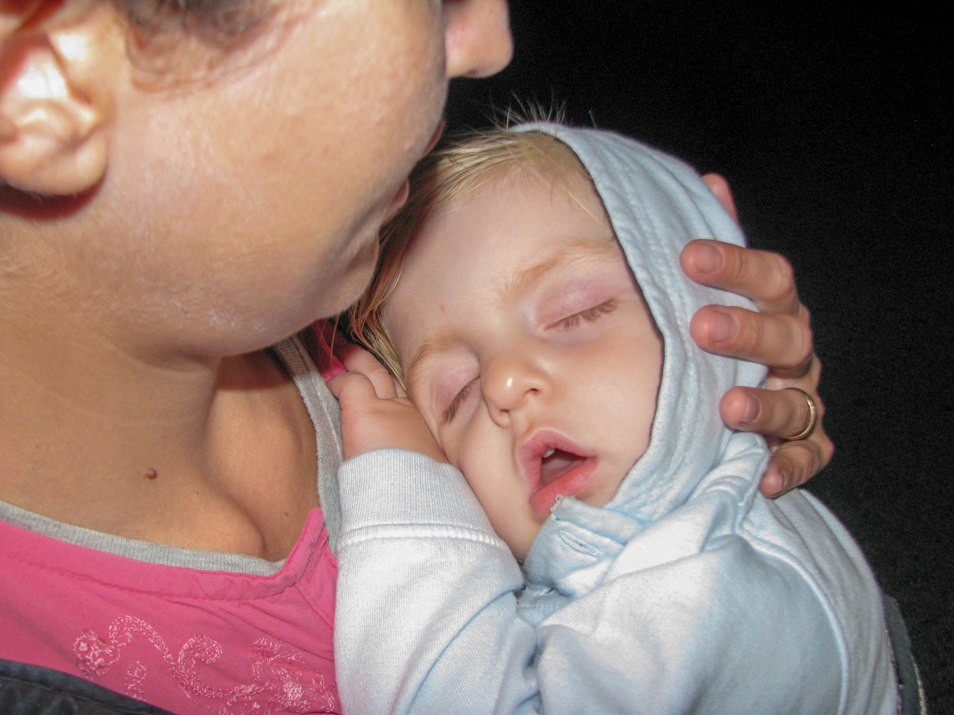 Alexander asleep on Sima's  feet.