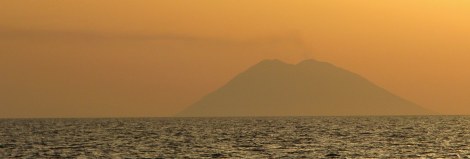 Stromboli, an active volcano, blows off a little steam at sunset.