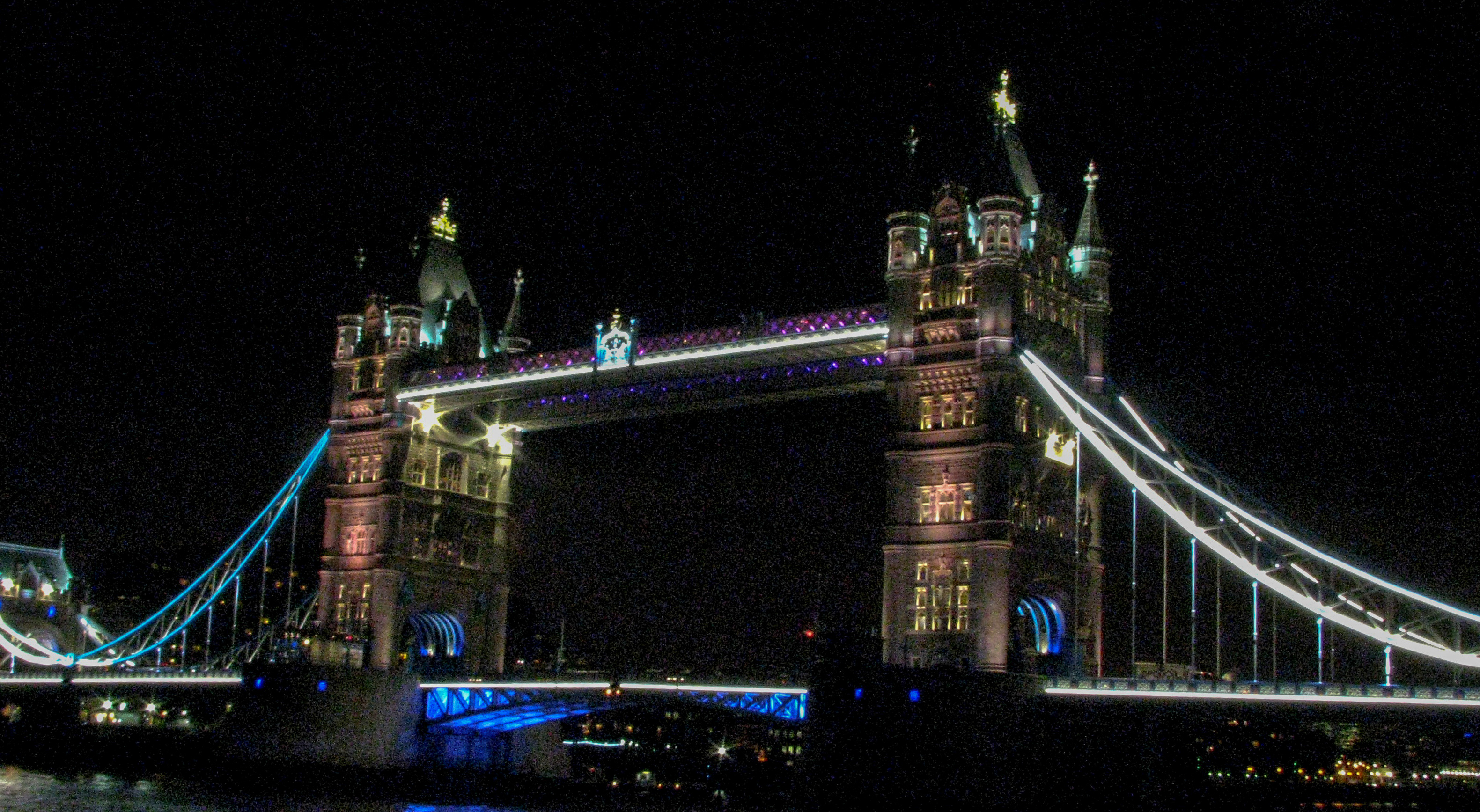 Leander's neighbor at St. Katherine's dock, the Tower Bridge, lit up at night.